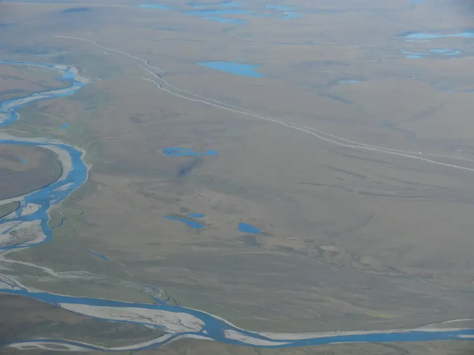 Aerial view of a vast river landscape with meandering rivers.