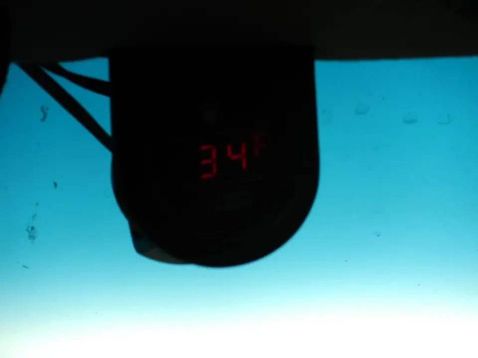 A digital thermometer shows a temperature of 34 degrees Fahrenheit.