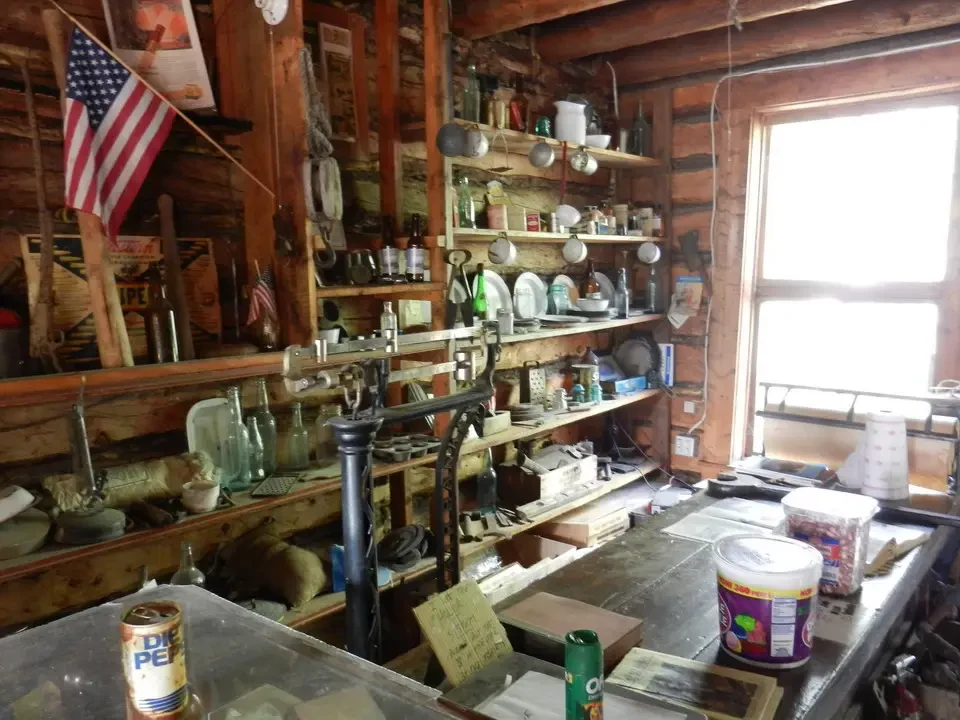 A rustic shop full of wooden objects and shelves.