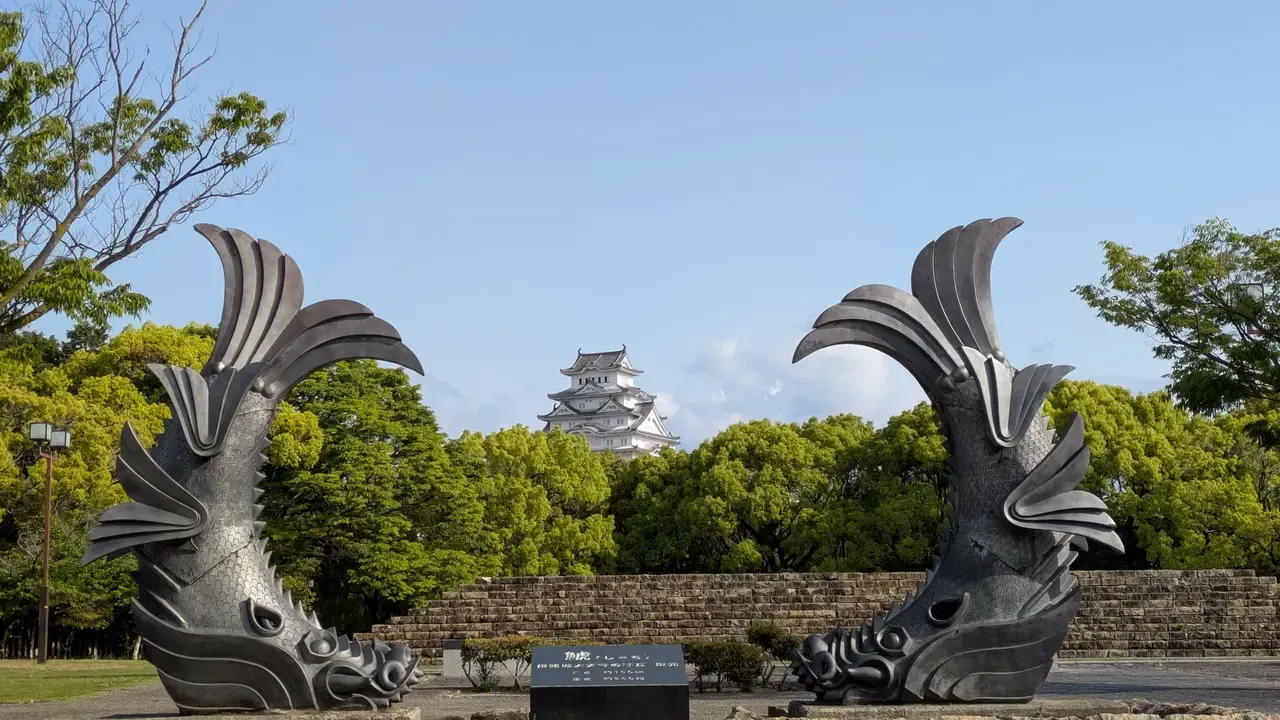I torii gates frame a view of Himeji Castle in Japan.