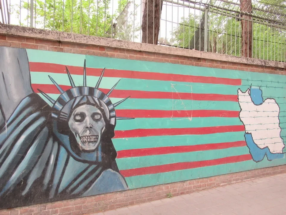 Mural depicting a stylized face and map of Iran with horizontal stripes.