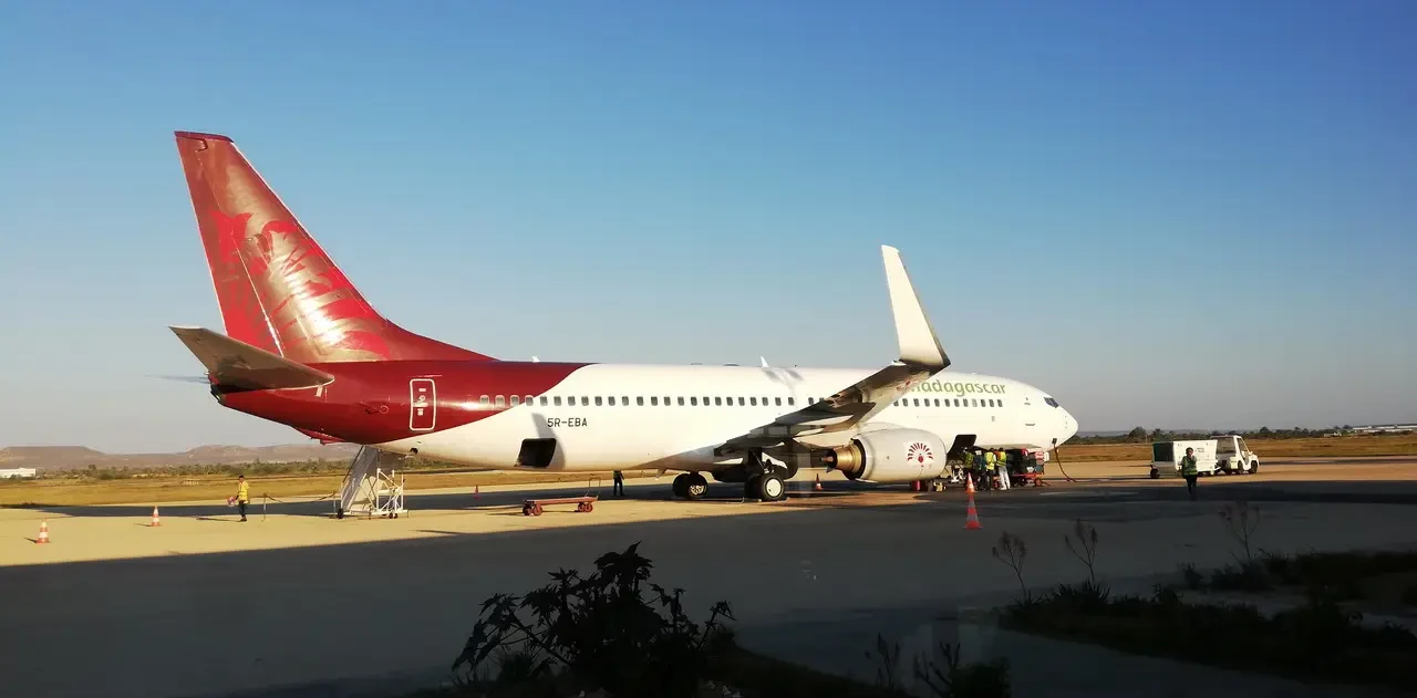A commercial airplane is parked on the tarmac at an airport in Madagascar.