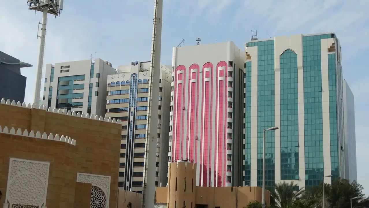 Skyline of modern buildings under a bright sky in Abu Dhabi, Oman or Emirates.