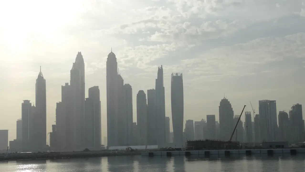Skyline of Dubai and Palm Jumeirah from the water.