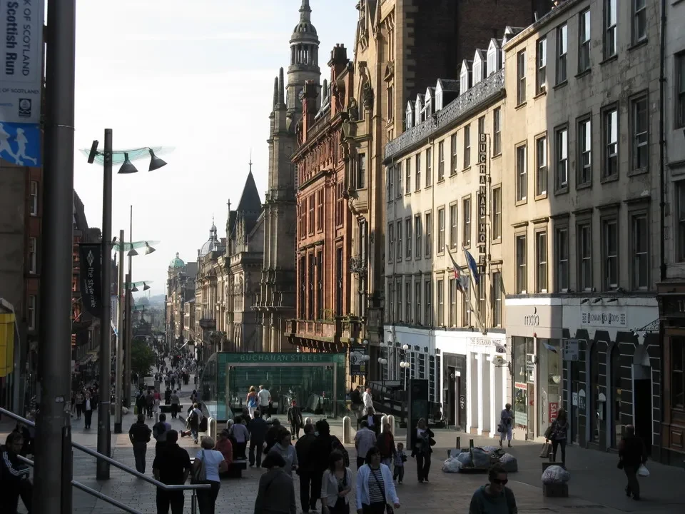 A view of a city street with historic buildings in Scotland.